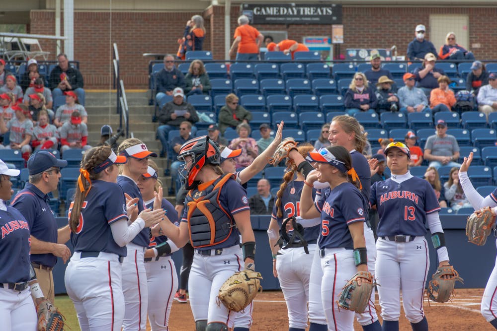 <p>Auburn celebrates a victory over Delaware State during the Plainsman Invite on Feb. 26.&nbsp;</p>