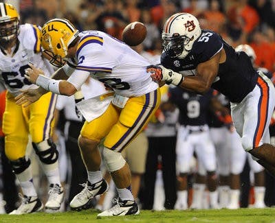 Auburn's Corey Lemonier sacks LSU quarterback Zach Mattenberger in the first half causing a fumble that Auburn recovered Saturday, Sept. 22. (Courtesy of Todd Van Emst)