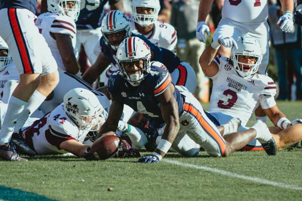 Tank Bigsby (4) scores a touchdown against Mississippi State on Nov. 13, 2021 in Auburn, AL.