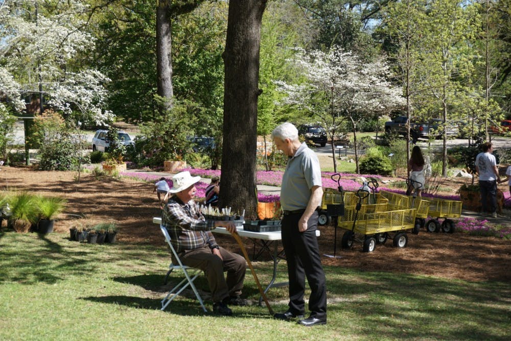 Members of the community talk during the Azalea Festival&nbsp;at Auburn University's Donald E. Davis Arboretum on Saturday, March 31, 2018, in Auburn, Ala.