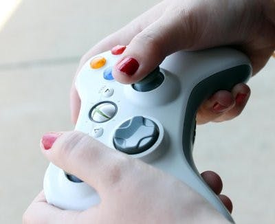 Over the past few years, there has been an increase in the number of women gamers. (Alex Sager / PHOTO EDITOR)
