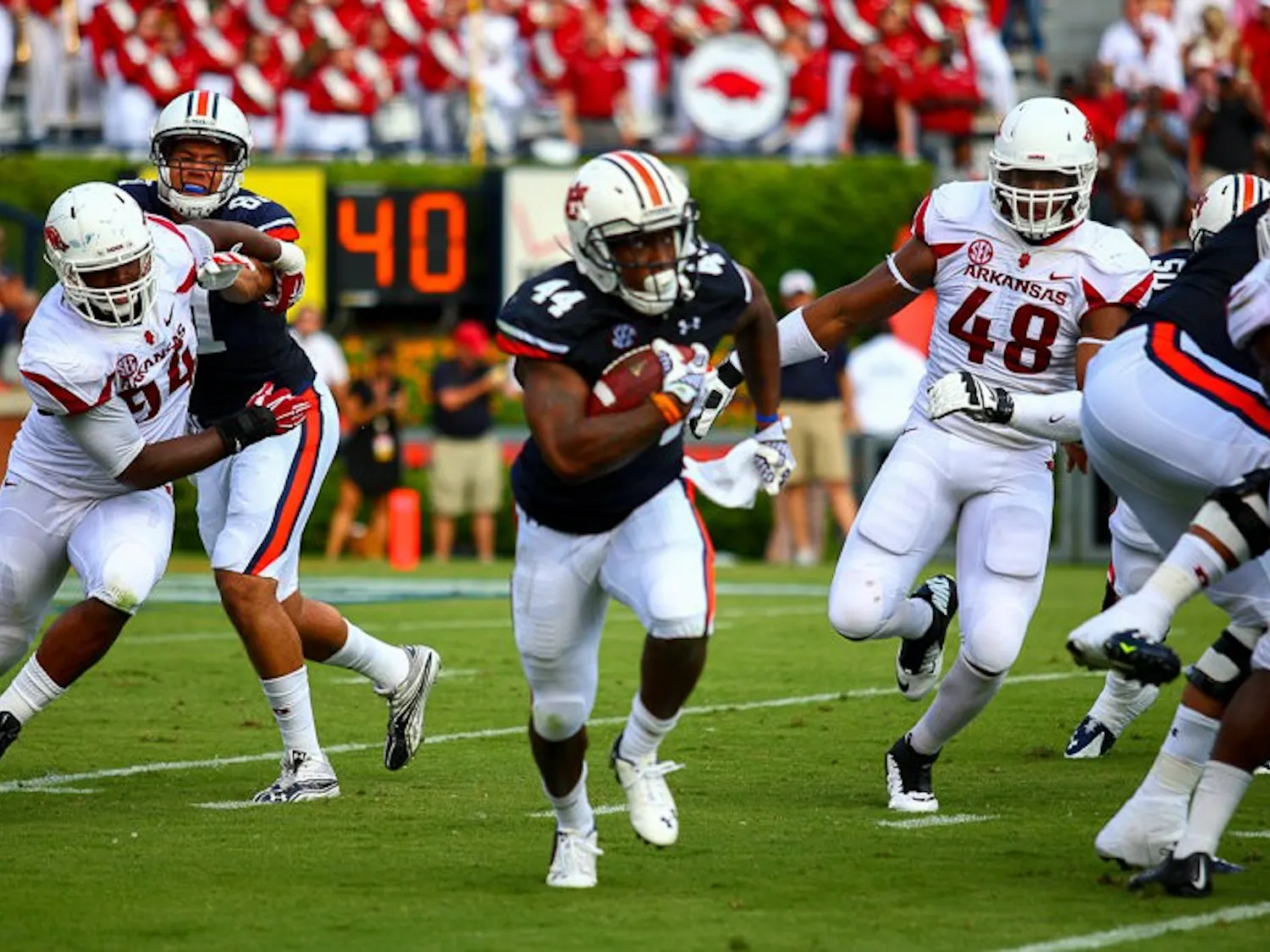 Cameron Artis-Payne (#44) runs with ball. Auburn vs. Arkansas, August 30, 2014. (Kenny Moss | Photographer)