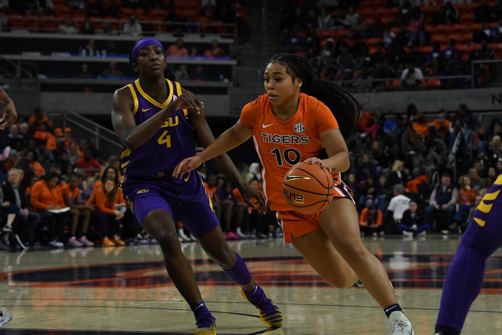 <p>Sania Richardson (10) making it around Flau'jae Johnson (4) during the Auburn vs LSU game on Sunday, February 8, 2026.</p>