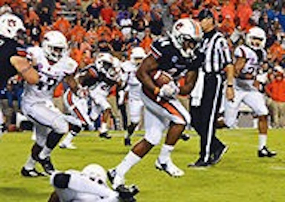 Senior Cameron Artis-Payne had a career-high of 26 carries and 177 yards in their season opening 45-21 victory over Arkansas. (Emily Enfinger | Assistant Photo Editor)