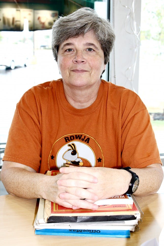 Mary Helen Brown Poses With Her Notebooks 