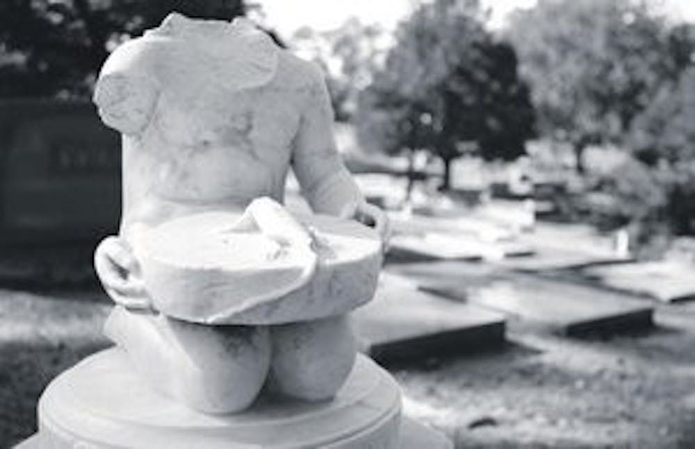 The headstone of Charles Stodghill Miles is alleged to be the most vandalized grave in Pine Hill Cemetery on Armstrong Street. Miles was only a child when he died of an allergic reaction to an insect bite. (Rebecca Croomes / PHOTO EDITOR)