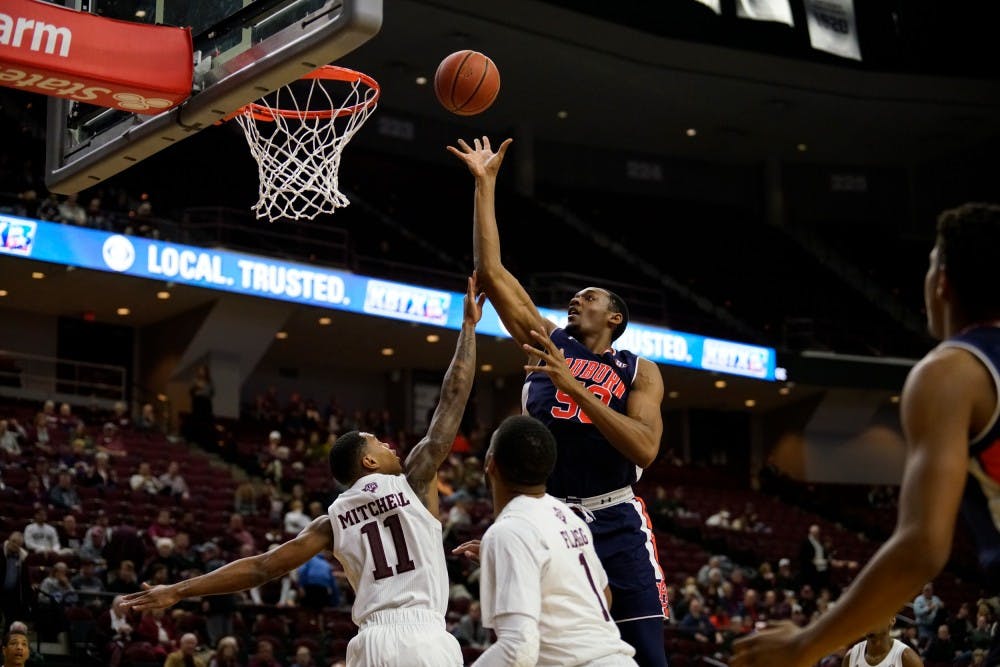 <p>Austin Wiley (50) scores during Auburn men's basketball vs. Texas A&amp;M in College Station, Texas, on Jan. 16, 2019.</p>