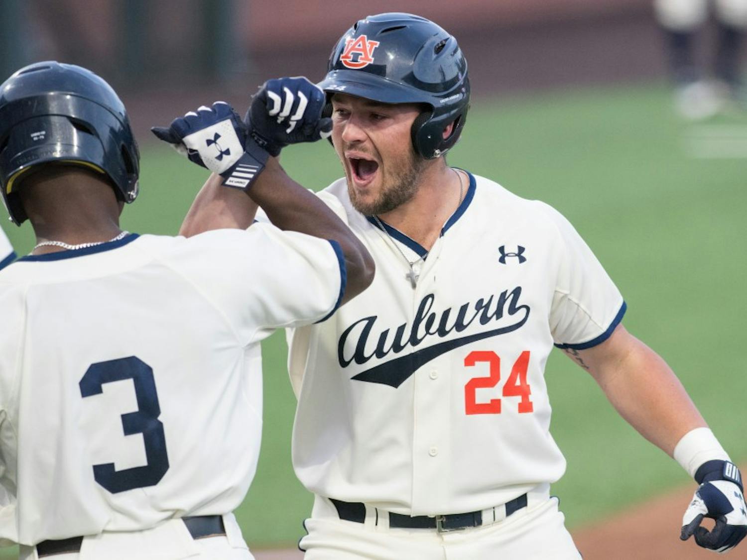 Conor Davis celebrates his three run homerun during Auburn vs. Vanderbilt baseball on Friday, May 4, 2018, in Auburn, Ala.