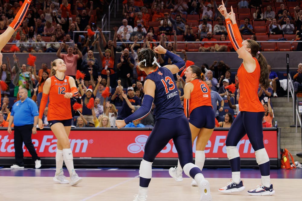 <p>Auburn University Volleyball players celebrate against the University of Georgia on Oct. 4, 2024.</p>