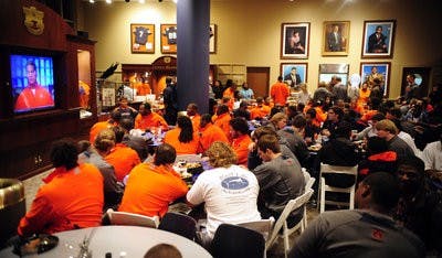 The Auburn football team watches the BCS show Sunday night in Auburn, Ala. (Todd Van Emst / Auburn Media Relations)