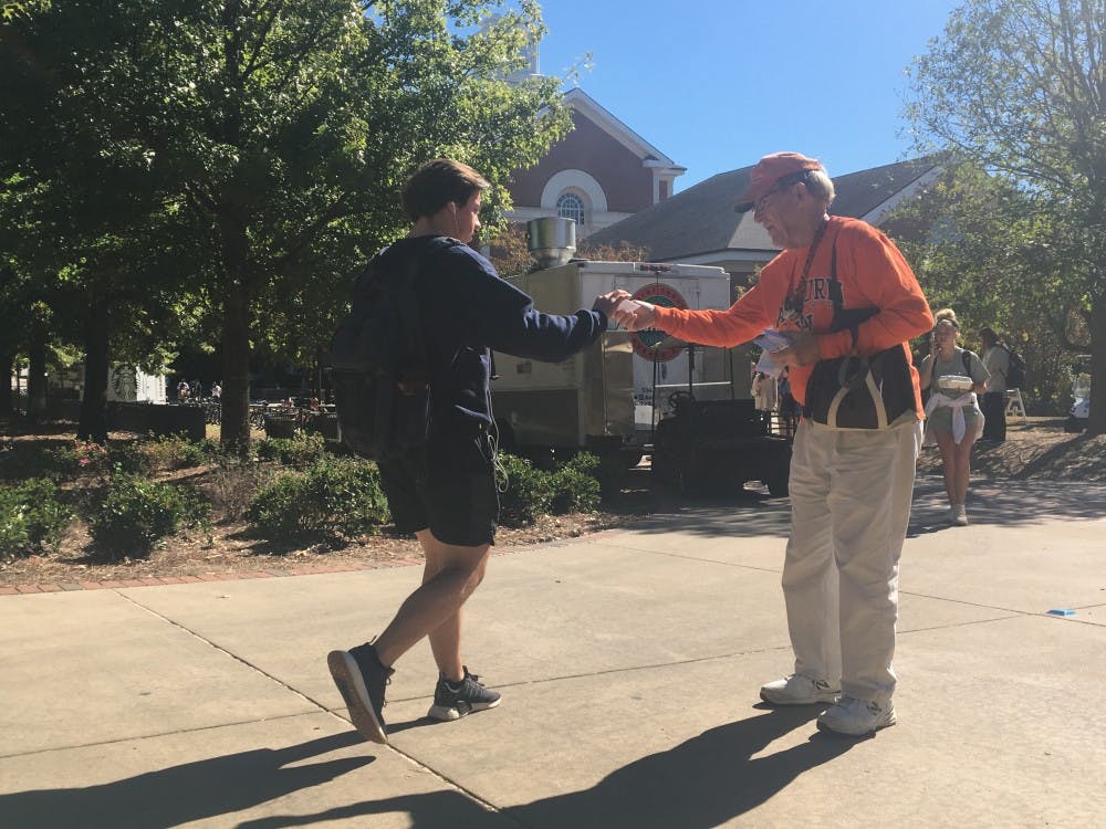 Ray Tarrer hands out pamphlets in front of Parker Hall on October 29, 2018 in Auburn, Ala. 