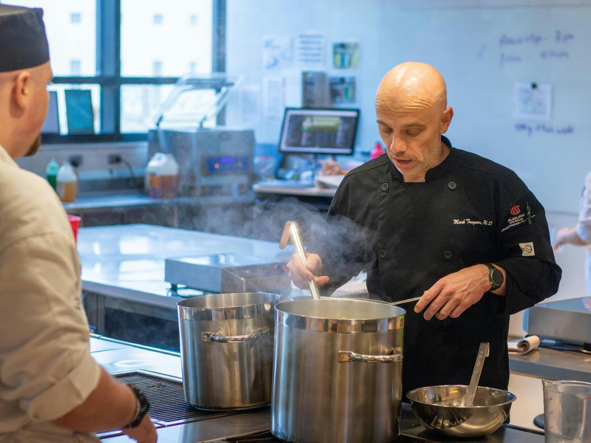 Director of Culinary Science Mark Traynor instructs a student in the Tony & Libba Rane Culinary Science Center on Sept. 24, 2025.