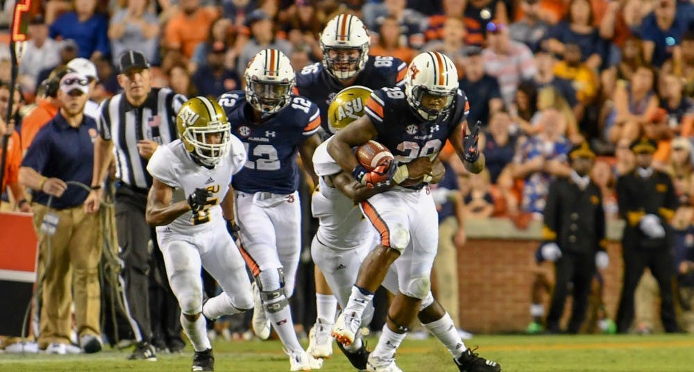 <p>JaTarvious Whitlow (28) runs down the field with the ball during Auburn football vs Alabama State on Saturday, Sept. 8, 2018, ​in Auburn, Ala.</p>