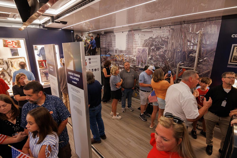 <p>On Sept. 11, 2025, attendants of the Tunnel to Towers: 9/11 Never Forget Mobile Exhibit stand and look upon images and physical reminders of what occurred 24 years ago.</p>