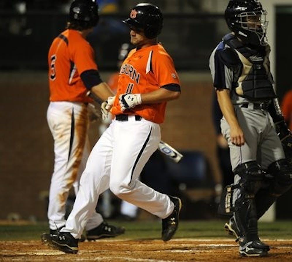 Senior infielder Wes Gilmer runs in for a score during the Samford game at home last spring. (Plainsman Archives)