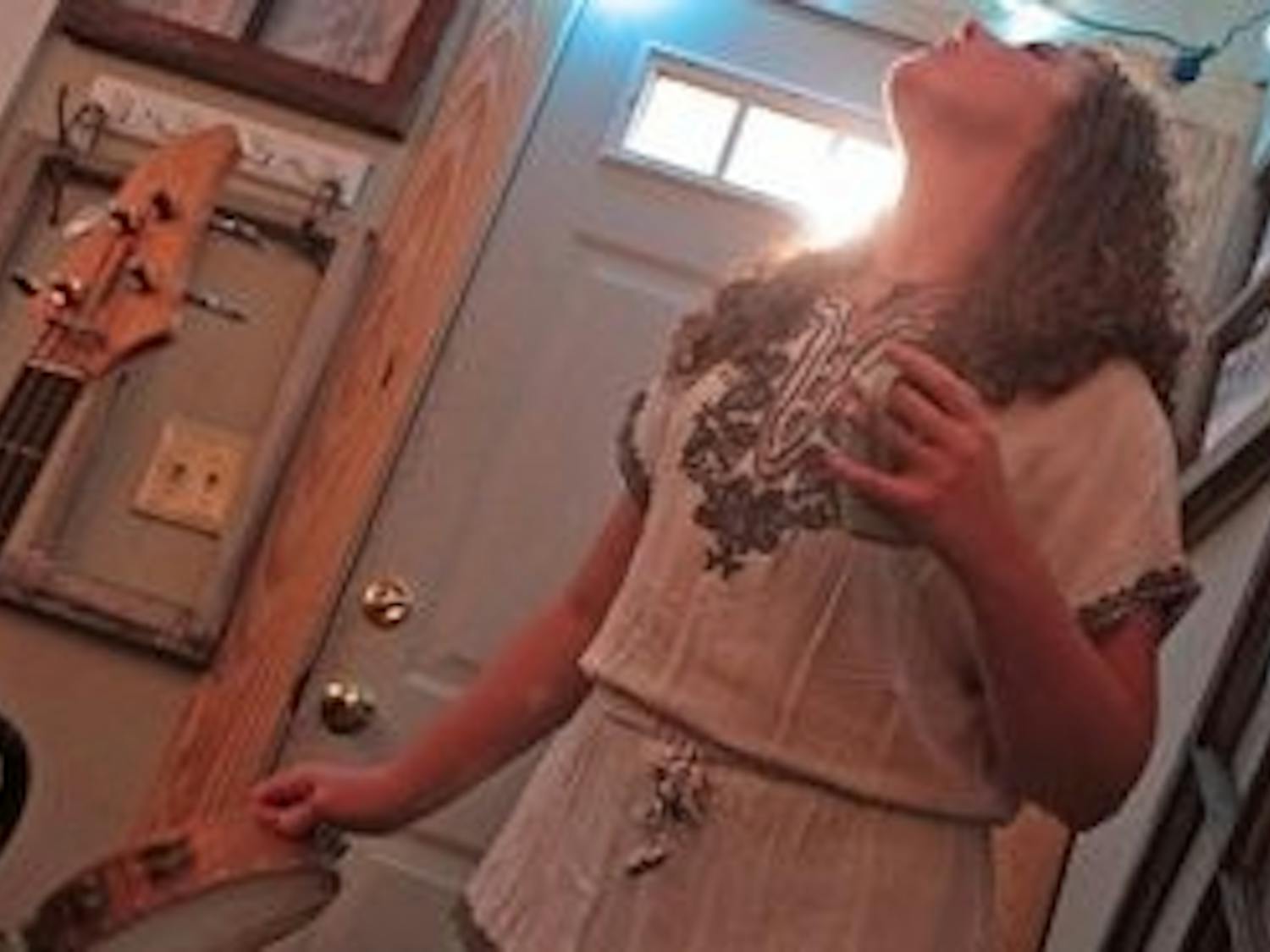 Bethany Whitehead sings harmony and plays tambourine in Adventure the Great. (Rebecca Croomes / PHOTO EDITOR)