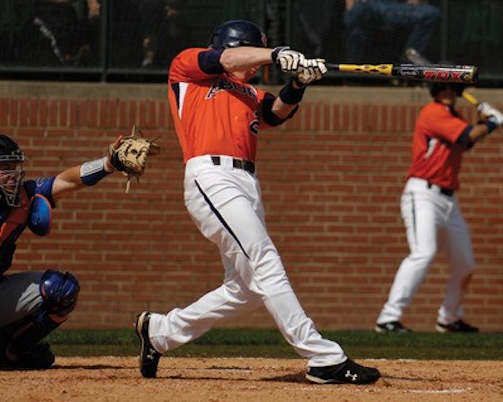 Auburn's Justin Hargett hits a home run in the 11th inning to win the game over Florida 8-7 in a game continued from Friday night.Florida vs Auburn baseball on Saturday, April 11, 2009 in Auburn, Ala.Todd Van Emst