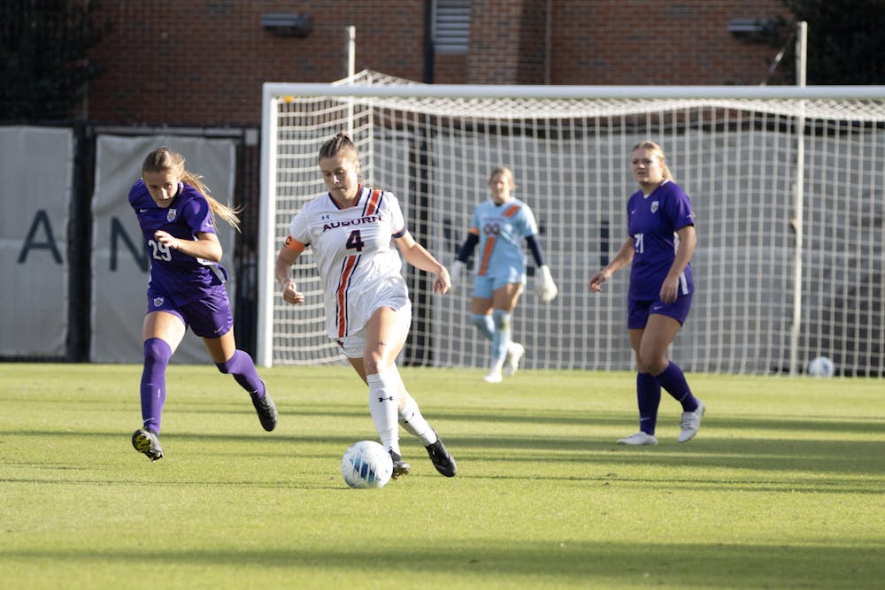 Anna Haddock (#4) dribbles down the field versus LSU at the Auburn Soccer Complex on October 22nd, 2023.