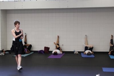 Lisa Padgett teaches one of her more challenging exercise classes, Wall Yoga, in the Student Activities Center.