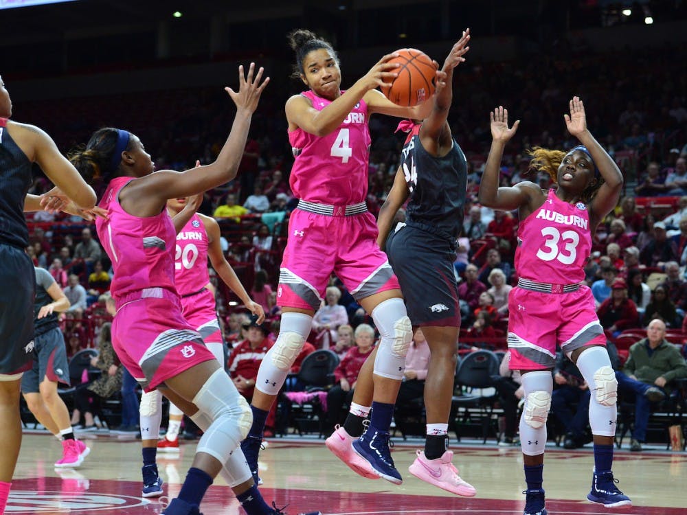 <p>Abigayle Jackson (4) grabs the ball during Auburn women's basketball vs. Arkansas on Feb. 10, 2019, in Fayetteville, Ark.</p>