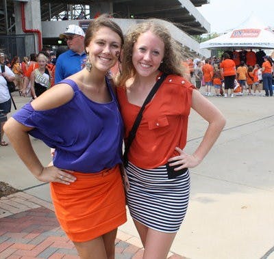 With bright tops tucked into their simple skirts, Shelby Baker and Tessa Harvill, both freshmen in pre-nursing, integrated the trend into their gameday apparel.