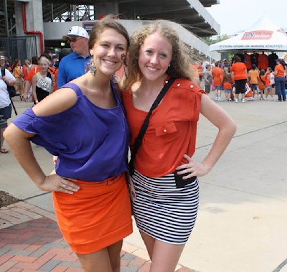 With bright tops tucked into their simple skirts, Shelby Baker and Tessa Harvill, both freshmen in pre-nursing, integrated the trend into their gameday apparel.