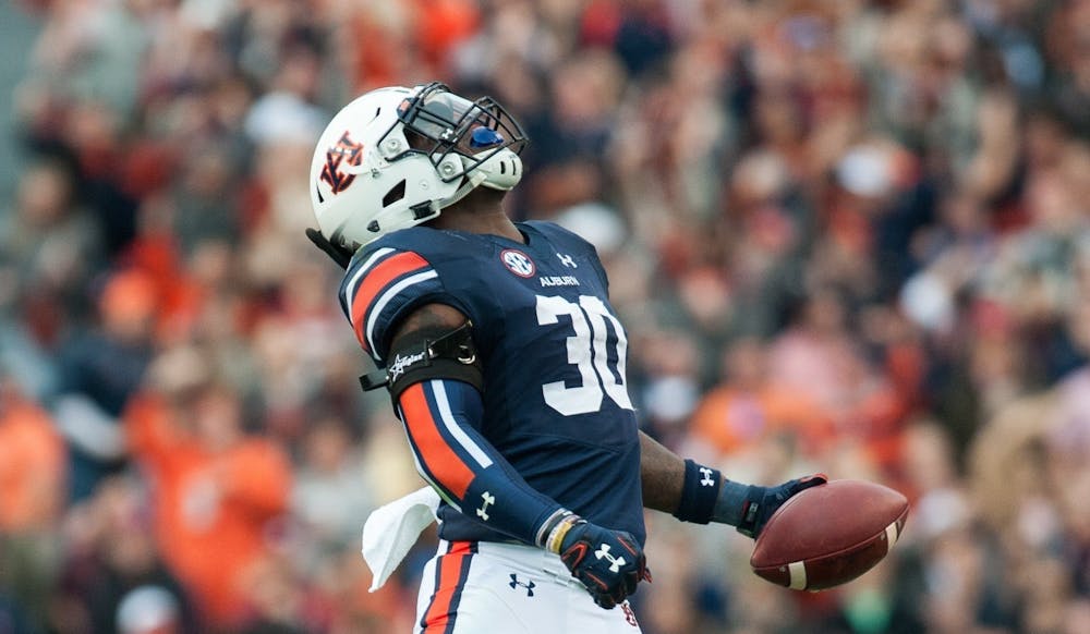 <p>Tre' Williams (30) celebrates after recovering a fumble in the first half. Auburn vs Alabama on Saturday, Nov. 25 in Auburn, Ala.</p>
