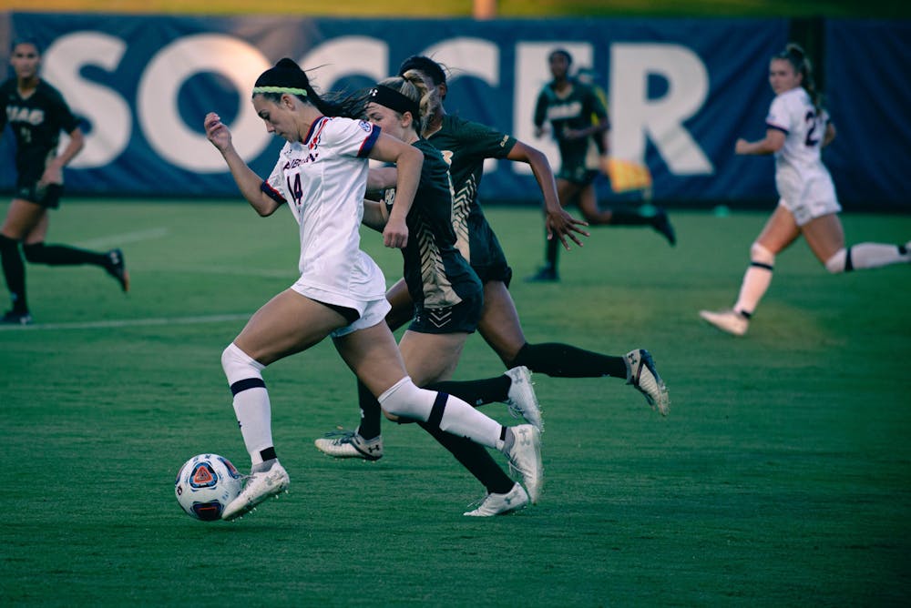 <p>Sydney Richards dribbles past defenders against UAB in Auburn, Alabama, on Sept. 9, 2021at the Auburn Soccer Complex</p>