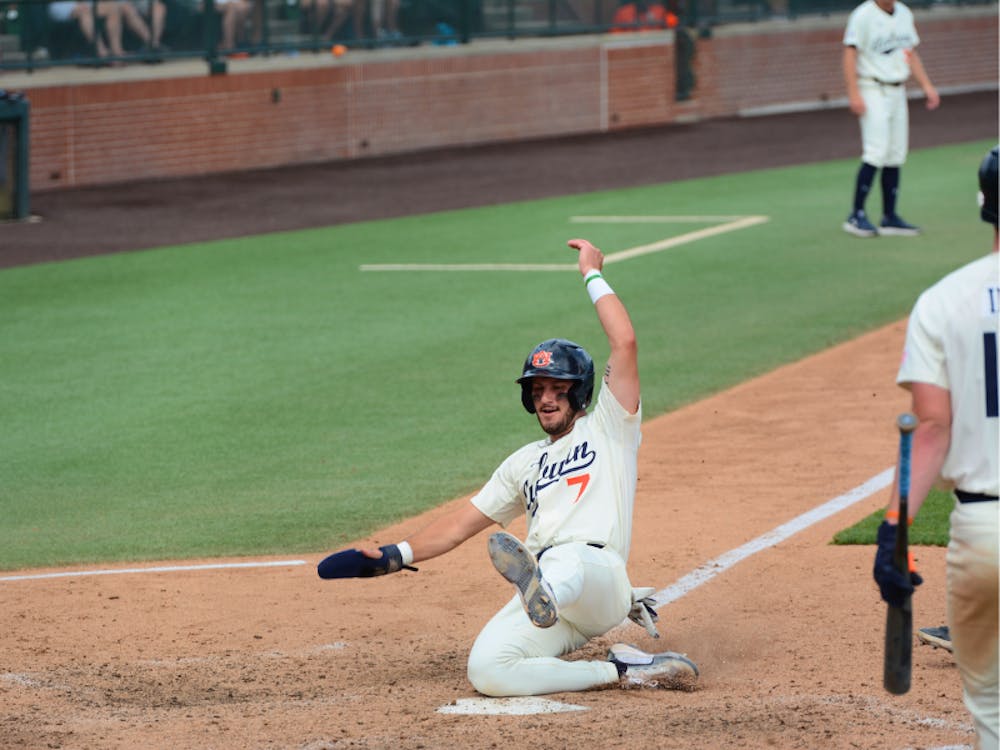 <p>Cole Foster slides into home in the eighth inning on a wild pitch in Auburn's final game against Missouri, tying the score at 7-7 before the Tigers went on to win 9-7.</p>