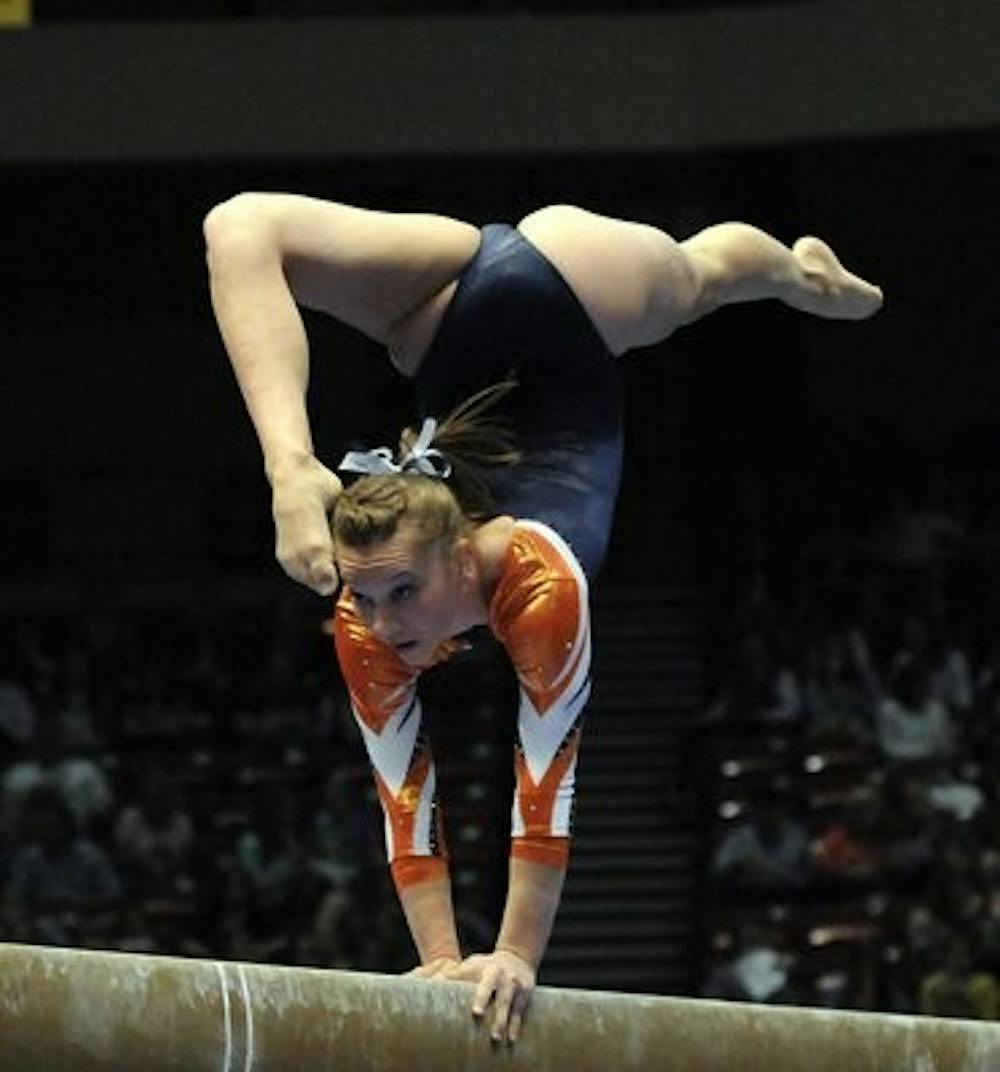Megan Walker competes on balance beam during the 2014 SEC Championship in Birmingham. (Contributed by Anthony Hall)