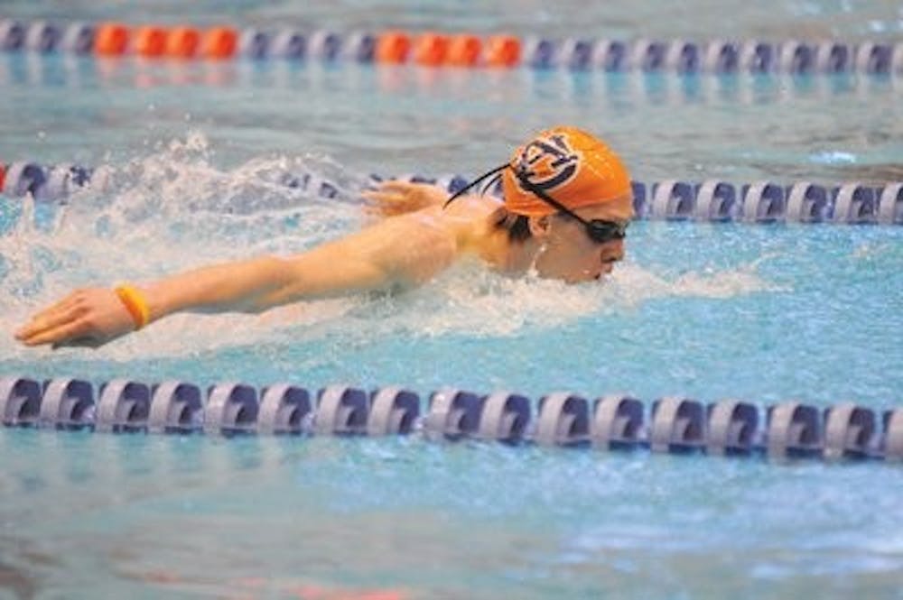 Freshman Zane Grothe swims the butterfly during Sunday's meet against Texas. Grothe finished third in the men's 1000-yard freestyle and finished fourth in the 500-yard freestyle. (Christen Harned / ASSISTANT PHOTO EDITOR)