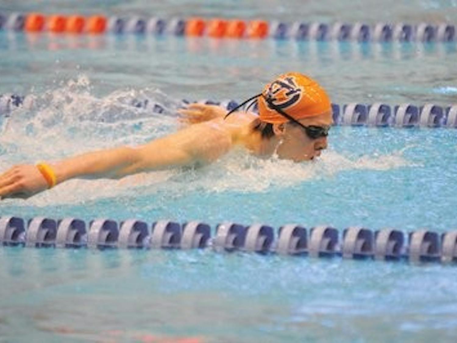 Freshman Zane Grothe swims the butterfly during Sunday's meet against Texas. Grothe finished third in the men's 1000-yard freestyle and finished fourth in the 500-yard freestyle. (Christen Harned / ASSISTANT PHOTO EDITOR)