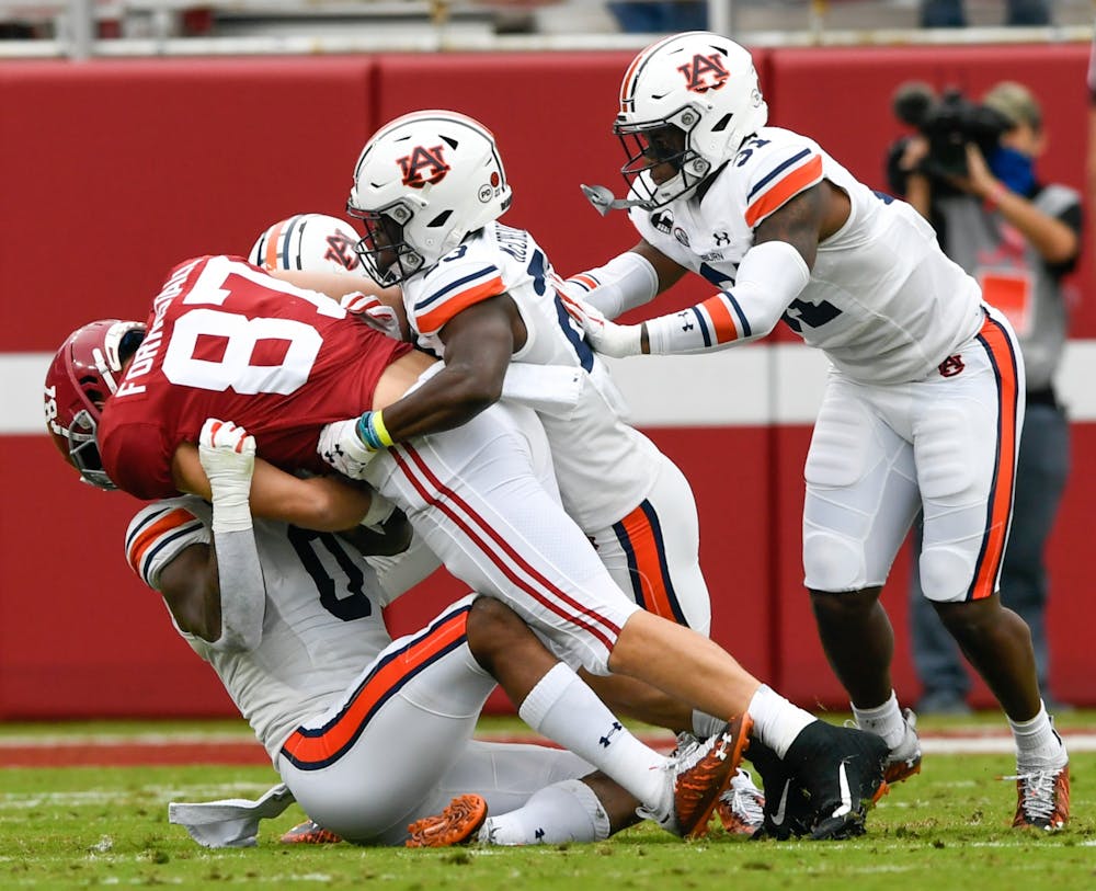 Oct 3, 2020; Tuscaloosa AL, USA; Owen Pappoe (0) with the tackle before the first down during the game between Auburn and Alabama at Bryant Denny Stadium. Mandatory Credit: Todd Van Emst/AU Athletics