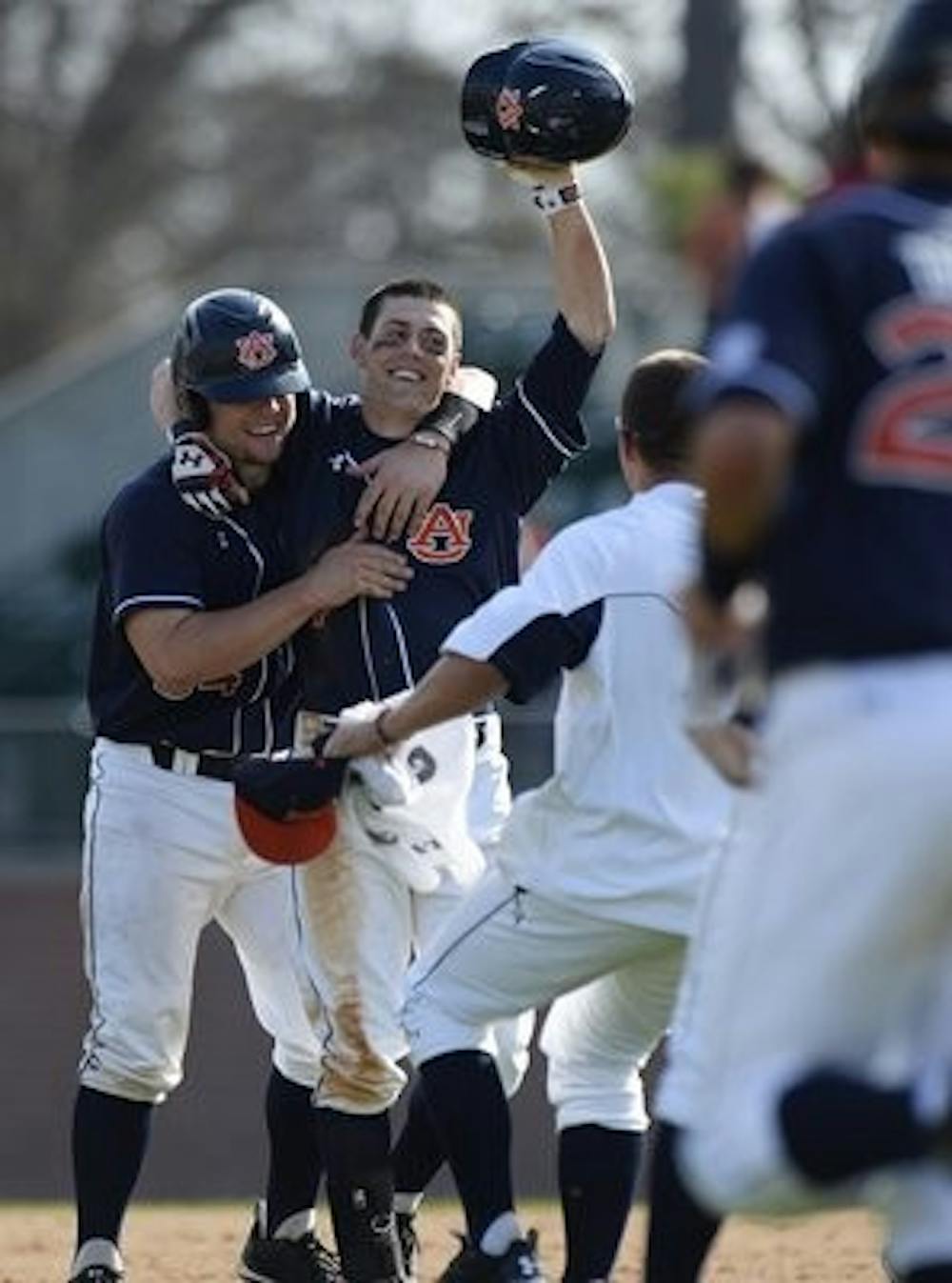 Ryan Tella celebrates his walk-off RBI single to beat Mercer on March 9. (Contributed by Zach Bland)