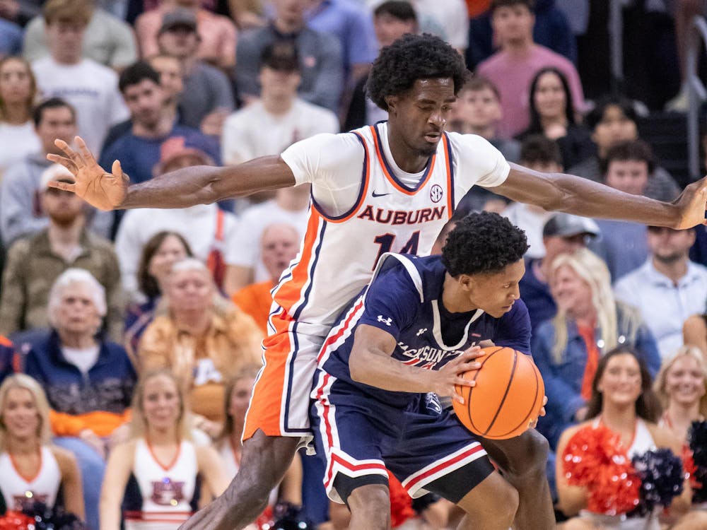 <p>Emeka Opurum plays defense against a Jackson State player during their game at Neville Arena in Auburn, Ala. on Nov. 19, 2025.</p>