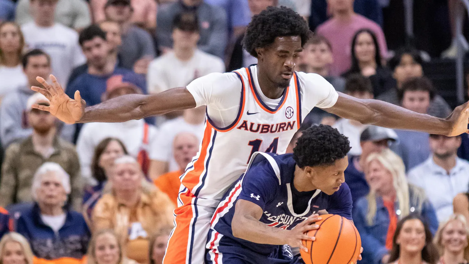 Emeka Opurum plays defense against a Jackson State player during their game at Neville Arena in Auburn, Ala. on Nov. 19, 2025.