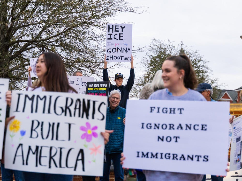 <p>Protesters gather on Toomer's Corner for the Signs of Facism protest on Feb. 18, 2026.</p>