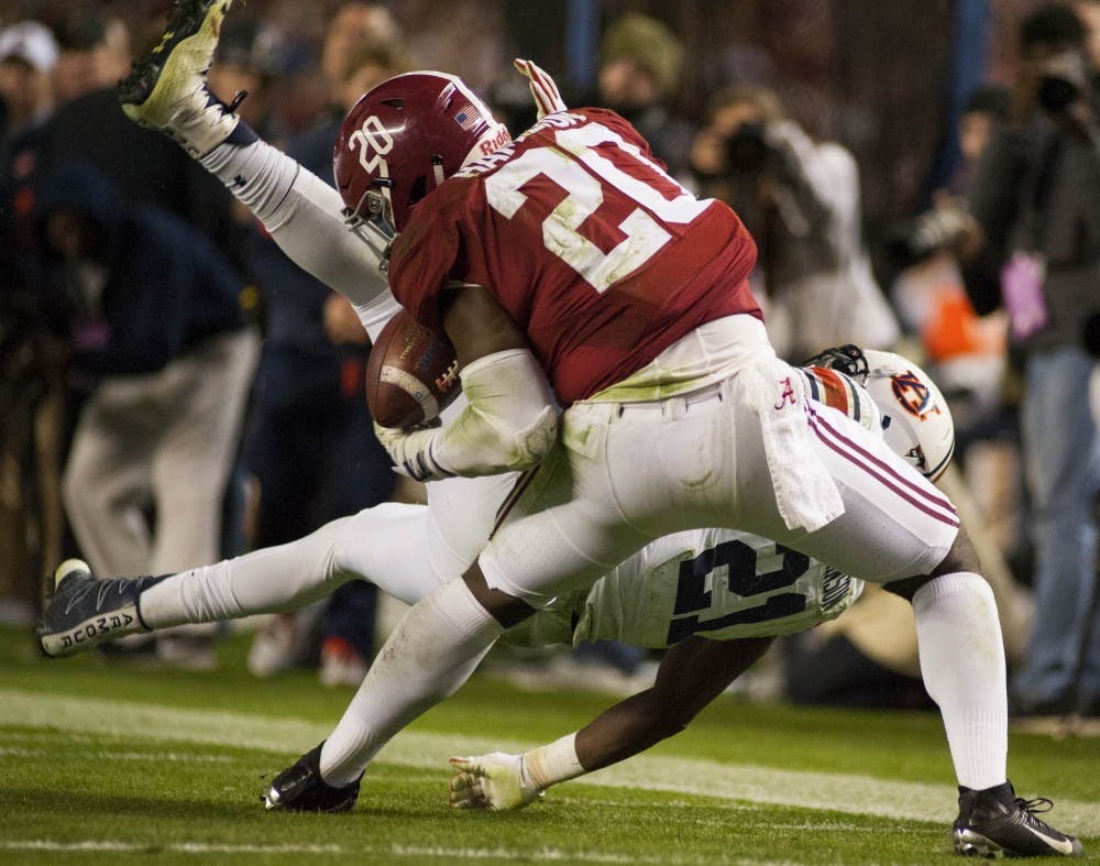 Alabama's Shaun Hamilton (20) intercepts a pass intended for Kerryon Johnson (21) in the second half. Auburn vs Alabama on Saturday, Nov. 26 in Tuscaloosa, AL.