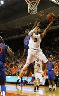 Chris Denson (3) strives for a layup against Florida on Saturday, Feb. 16. (Katherine McCahey / ASSISTANT PHOTO EDITOR)