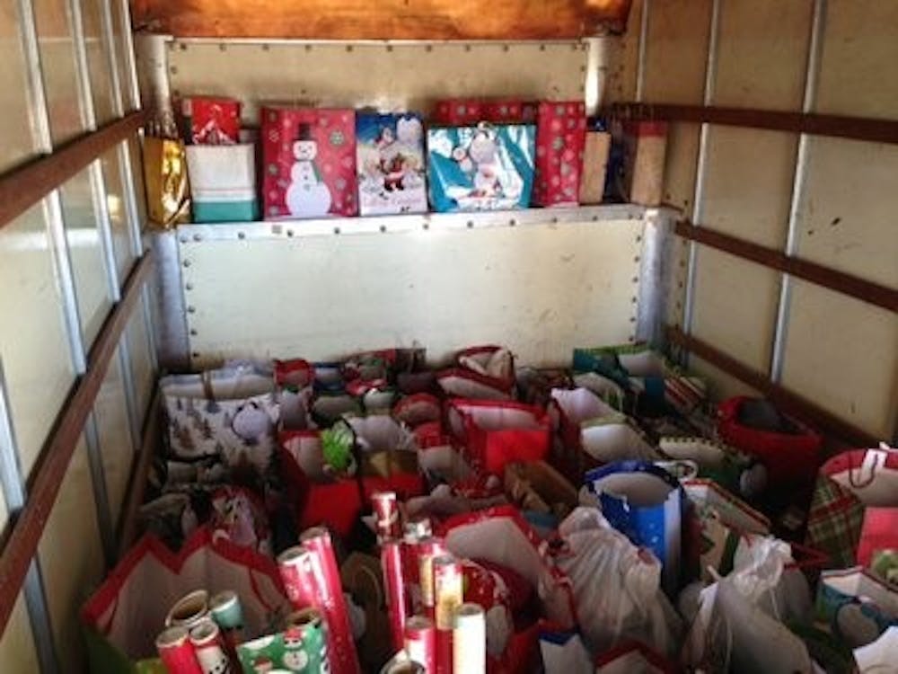 The Home Instead Senior Care employees pick up the gifts Dec. 12. (Contributed by Bridger Sager)
