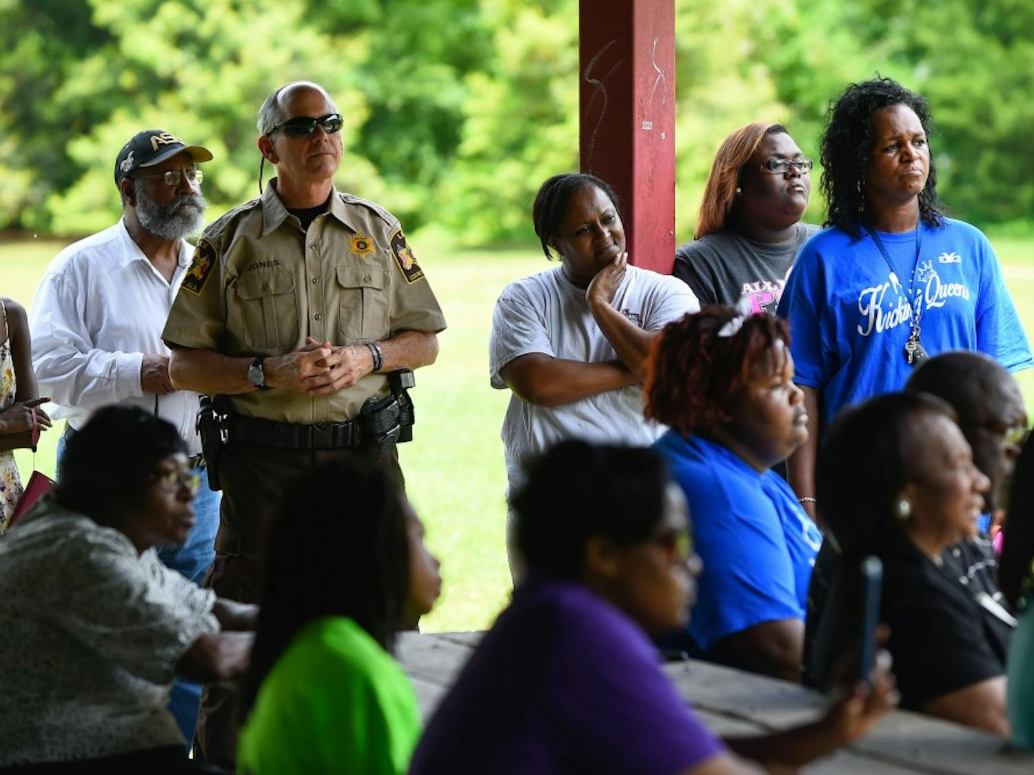 Auburn residents gather with Lee county sheriff Jay Jones&nbsp;during a separate&nbsp;Stop the Violence rally at Sam Harris Park on Sat. April 30, 2016 in Auburn, Ala. Opelika community members gathered earlier in June.