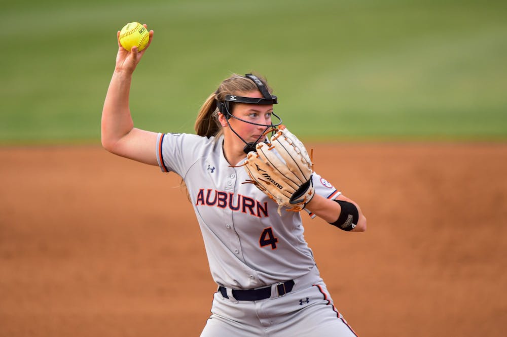 Apr 13, 2021; Auburn, AL, USA; Auburn Tigers Maddie Penta (4) throws to first for an out during the game between Auburn and Alabama State at Jane B. Moore Field. Mandatory Credit: Shanna Lockwood/AU Athletics