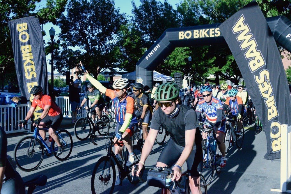 Bikers pass the starting line for Bo Bikes Bama on Saturday,
April 27, 2019 in Auburn, Ala