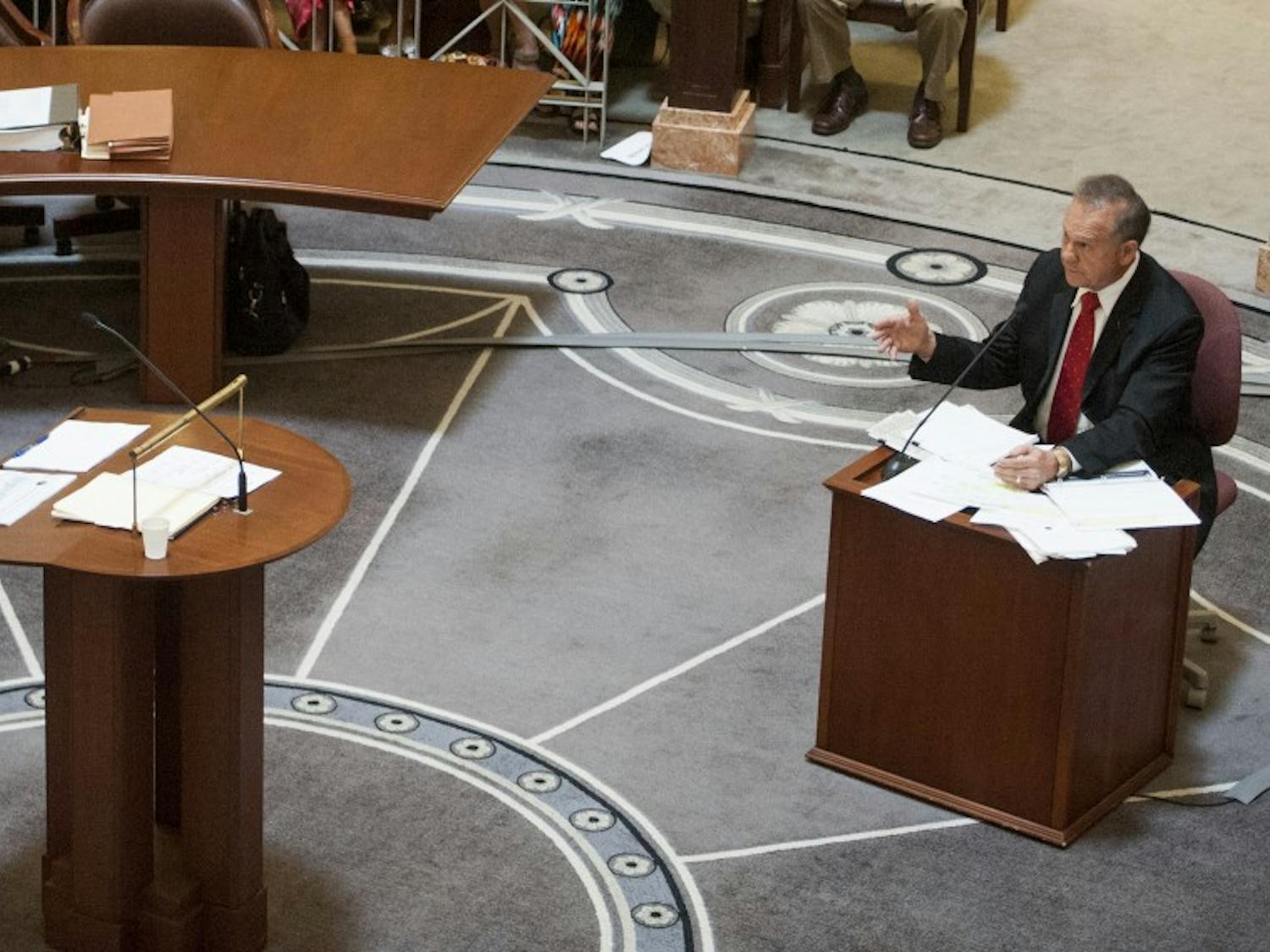 Embattled Alabama Chief Justice Roy Moore answers questions from his lawyer Philip Jauregui during Moore's ethics trial at the Alabama Judicial Building in Montgomery, Ala., on Wednesday September 28, 2016.