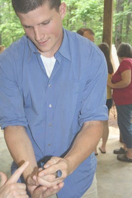 Visitors pet a bluebird at the Beautiful Bluebird program    Ashlea Draa/Photo Editor