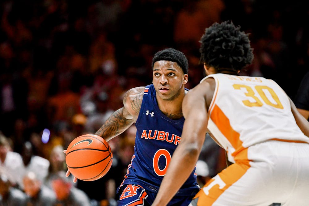 Auburn guard KD Johnson (0) drives to the basket against Tennessee, on February 4, 2023, in Knoxville, TN. 