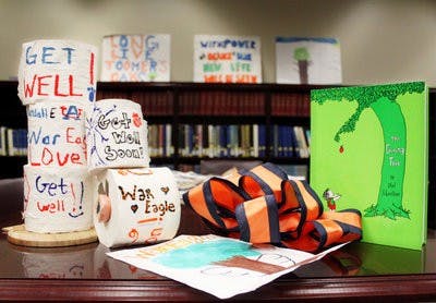 Artifacts and memorabilia left at Toomer's Corner after the trees were poisoned are on display in the Special Collections and Archives section of Ralph Brown Draughon library. (Emily Adams / Photo Editor)