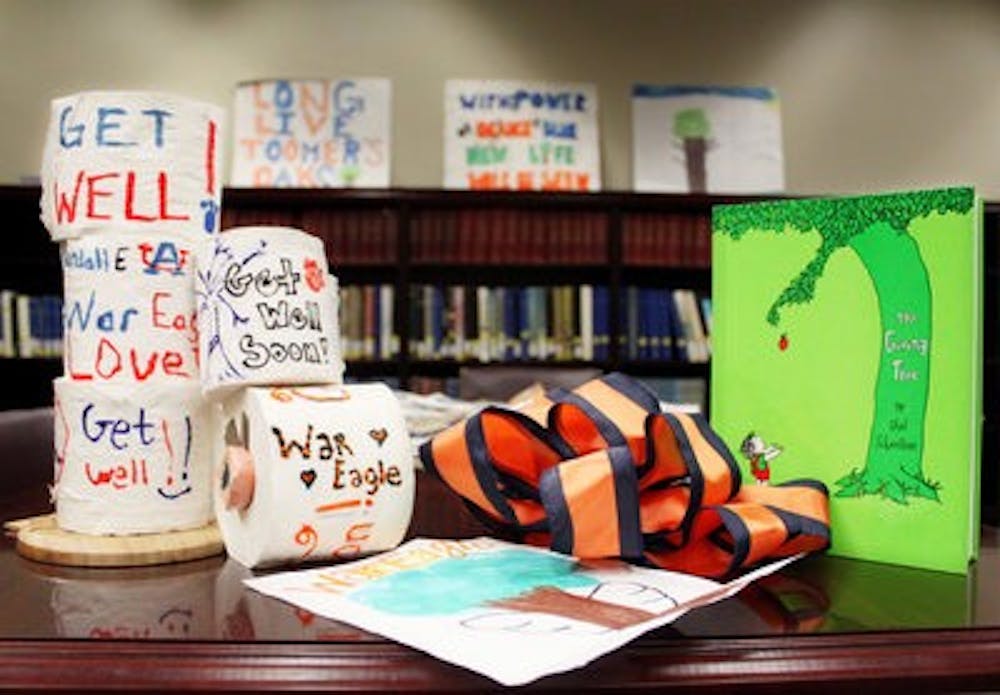 Artifacts and memorabilia left at Toomer's Corner after the trees were poisoned are on display in the Special Collections and Archives section of Ralph Brown Draughon library. (Emily Adams / Photo Editor)