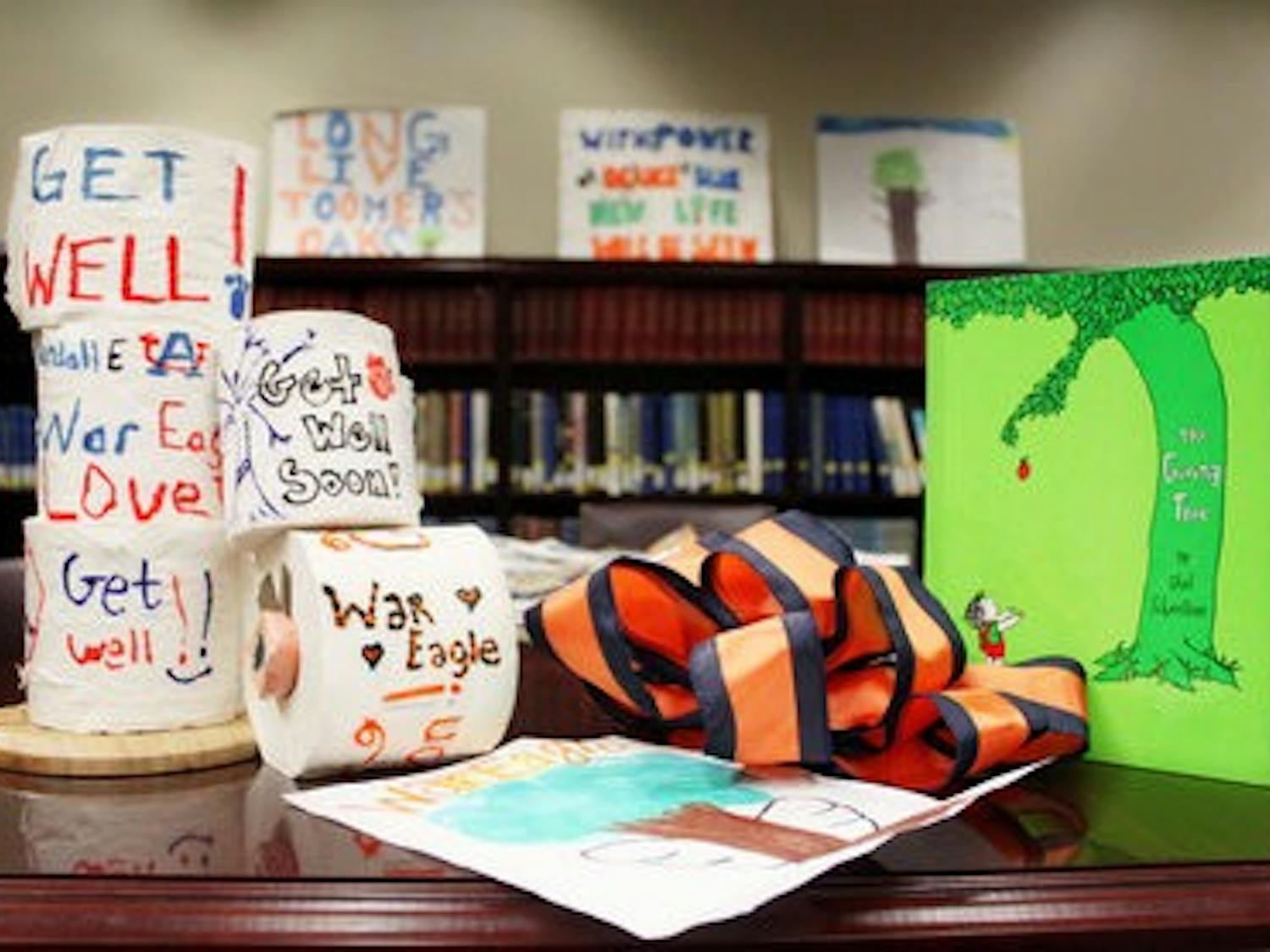 Artifacts and memorabilia left at Toomer's Corner after the trees were poisoned are on display in the Special Collections and Archives section of Ralph Brown Draughon library. (Emily Adams / Photo Editor)