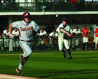 Freshman Jon Luke Jacobs throws out Florida State's Jason Stidham during Saturday's game. Auburn won 10-9, the Seminole's first loss.